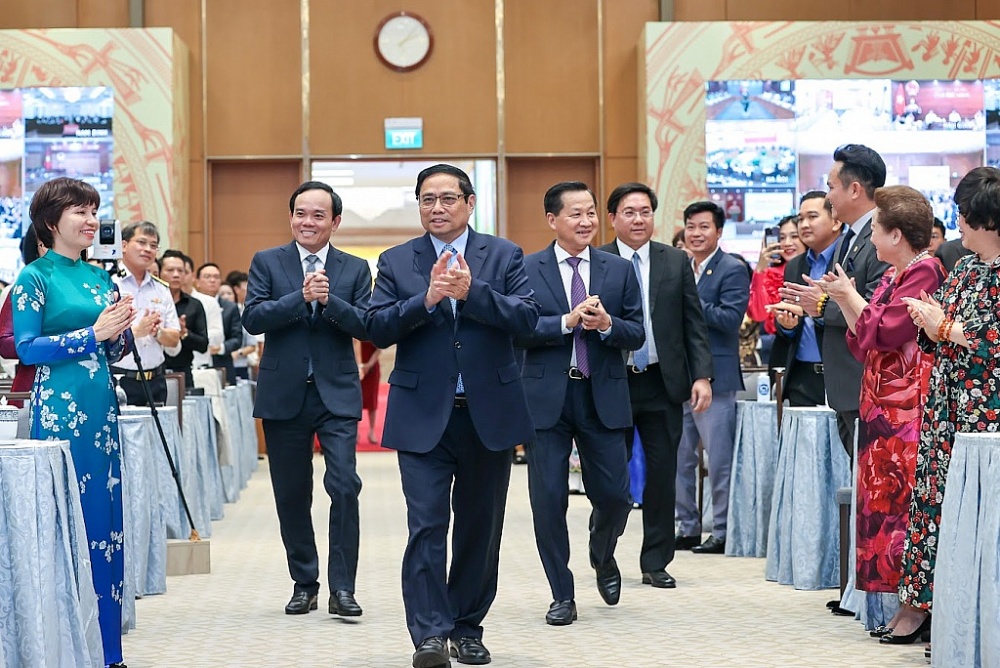 Thủ tướng Phạm Minh Chính cùng các Phó Thủ tướng Lê Minh Khái, Trần Lưu Quang tới dự buổi gặp mặt của Thường trực Chính phủ với đại diện doanh nhân Việt Nam. Ảnh: VGP